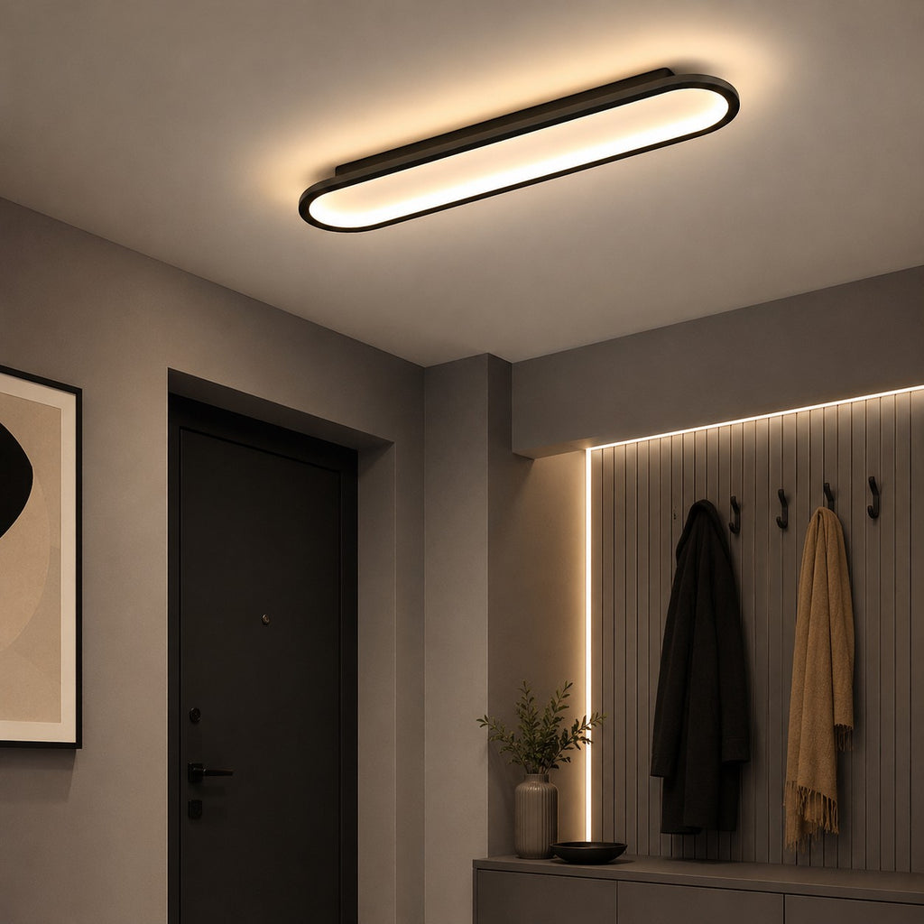 Plafonnier LED Lumiris noir et or, design ovale moderne, en métal et acrylique, pour salon.