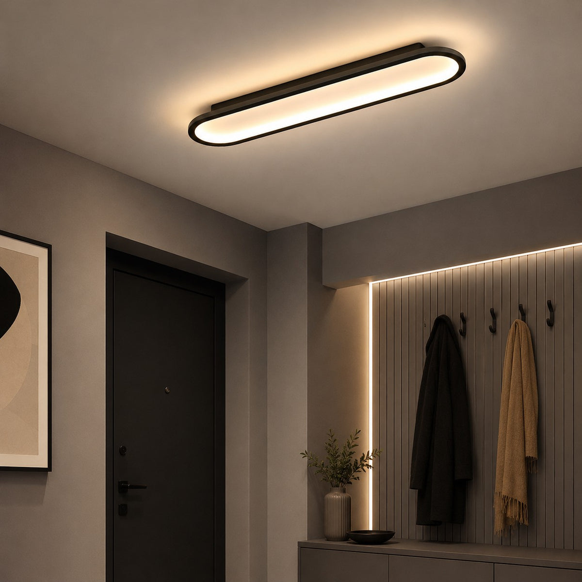 Plafonnier LED Lumiris noir et or, design ovale moderne, en métal et acrylique, pour salon.