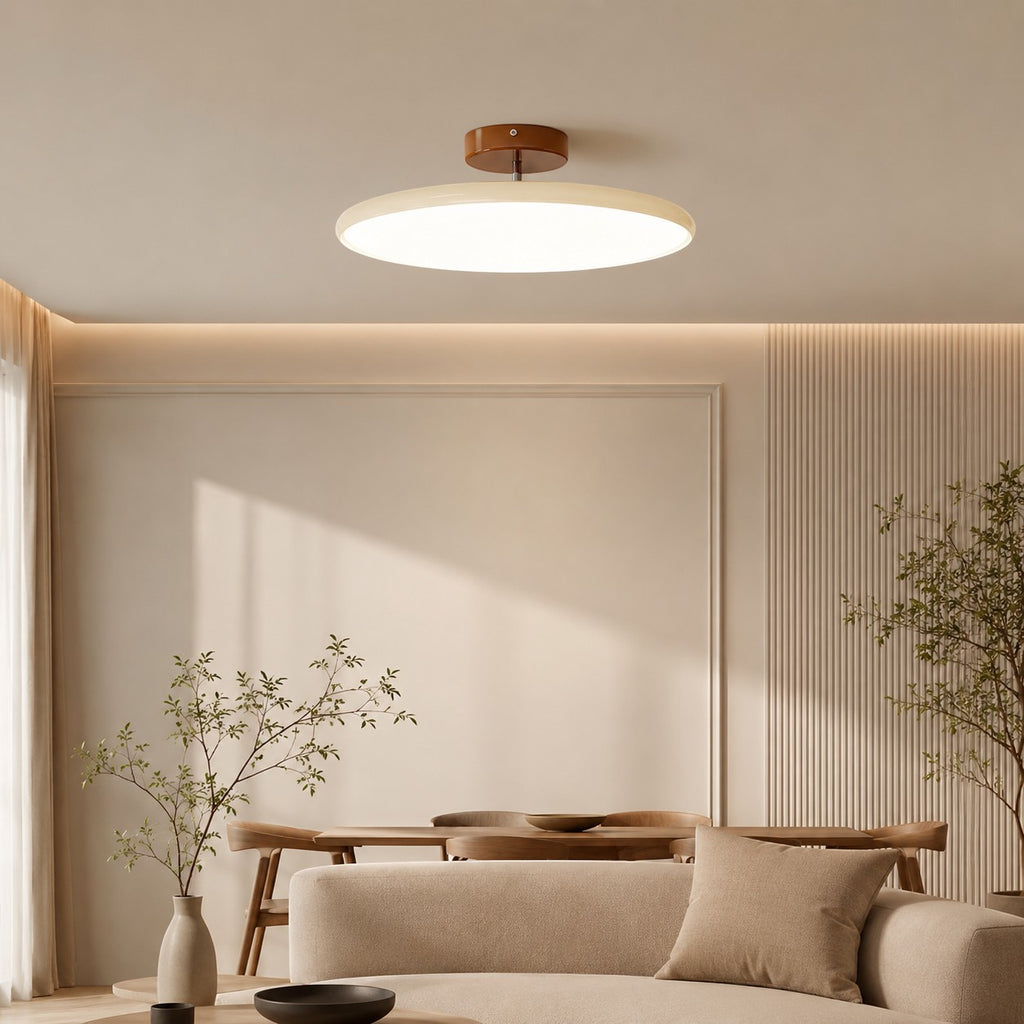 Plafonnier LED Lumiris rond en métal et acrylique blanc, design moderne et orientable, pour salon ou cuisine.