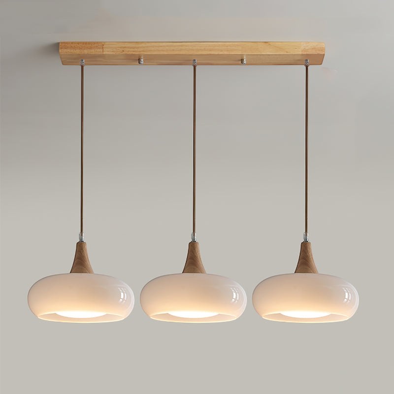Lumiris suspension en bois et verre blanc laiteux, 3 abat-jours ovales, design moderne pour cuisine ou salle à manger.
